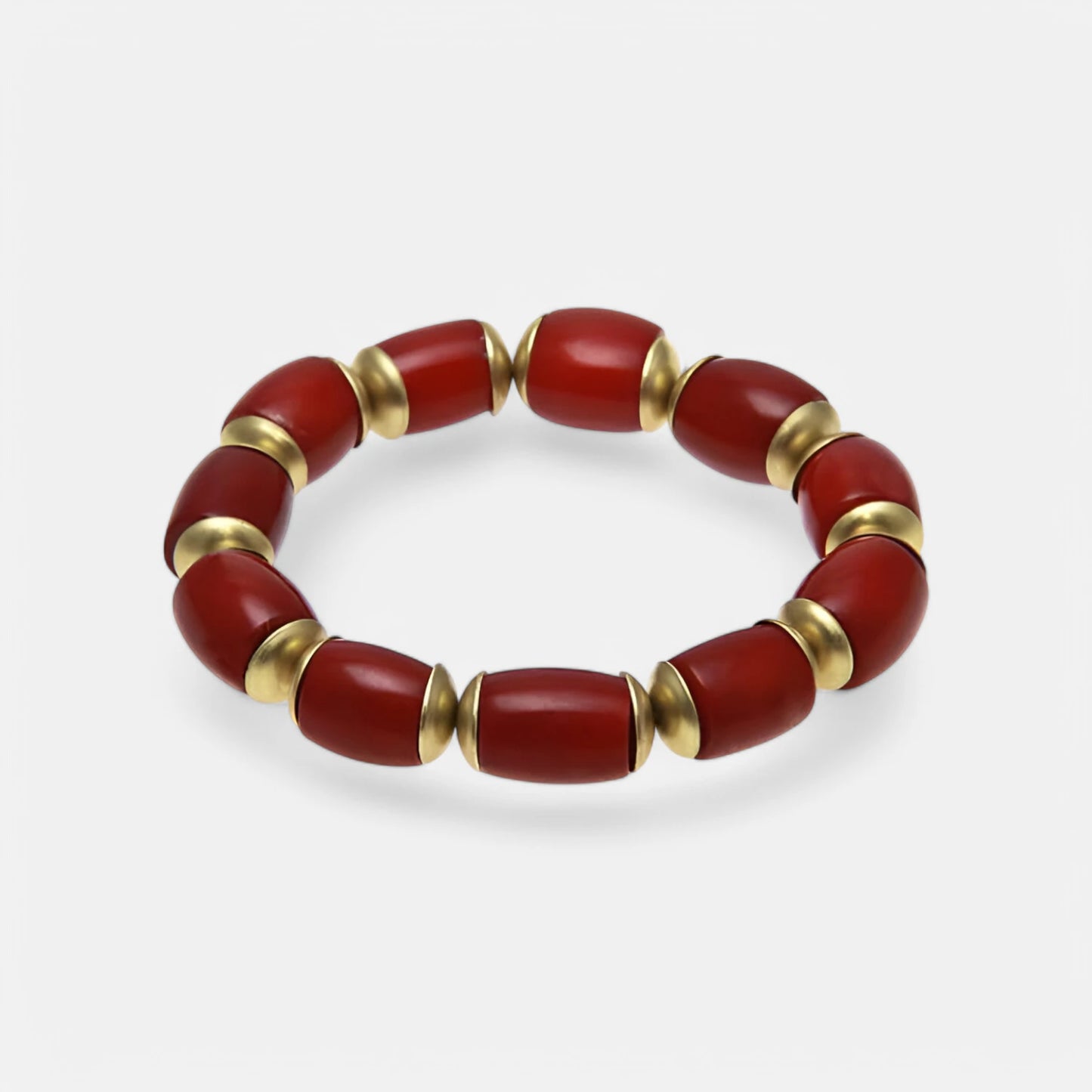 Elastisches Armband aus roten Bambuskorallen mit Messingscheiben