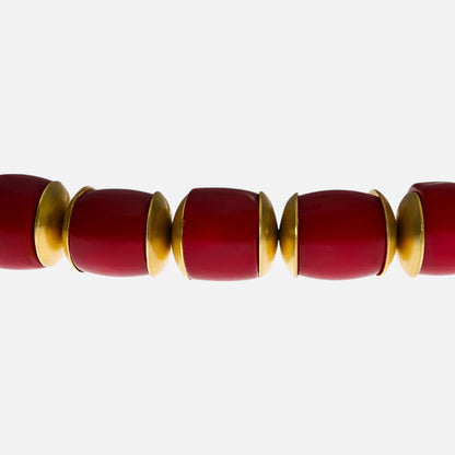 Elastisches Armband aus roten Bambuskorallen mit Messingscheiben